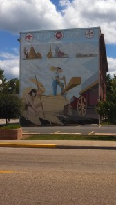 Mural of indian & settler on the side of a building in Mascoutah